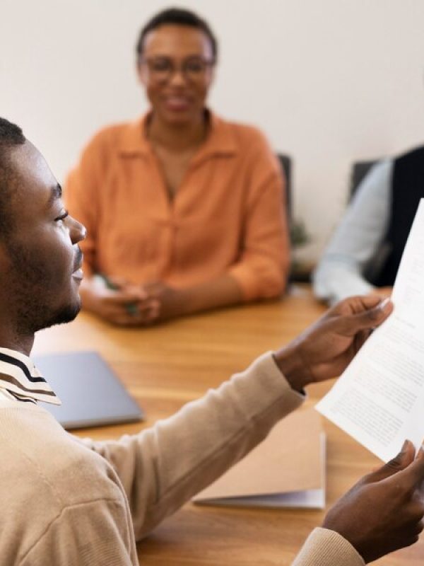 man-holding-contract-his-new-office-job-after-interview_23-2149034570